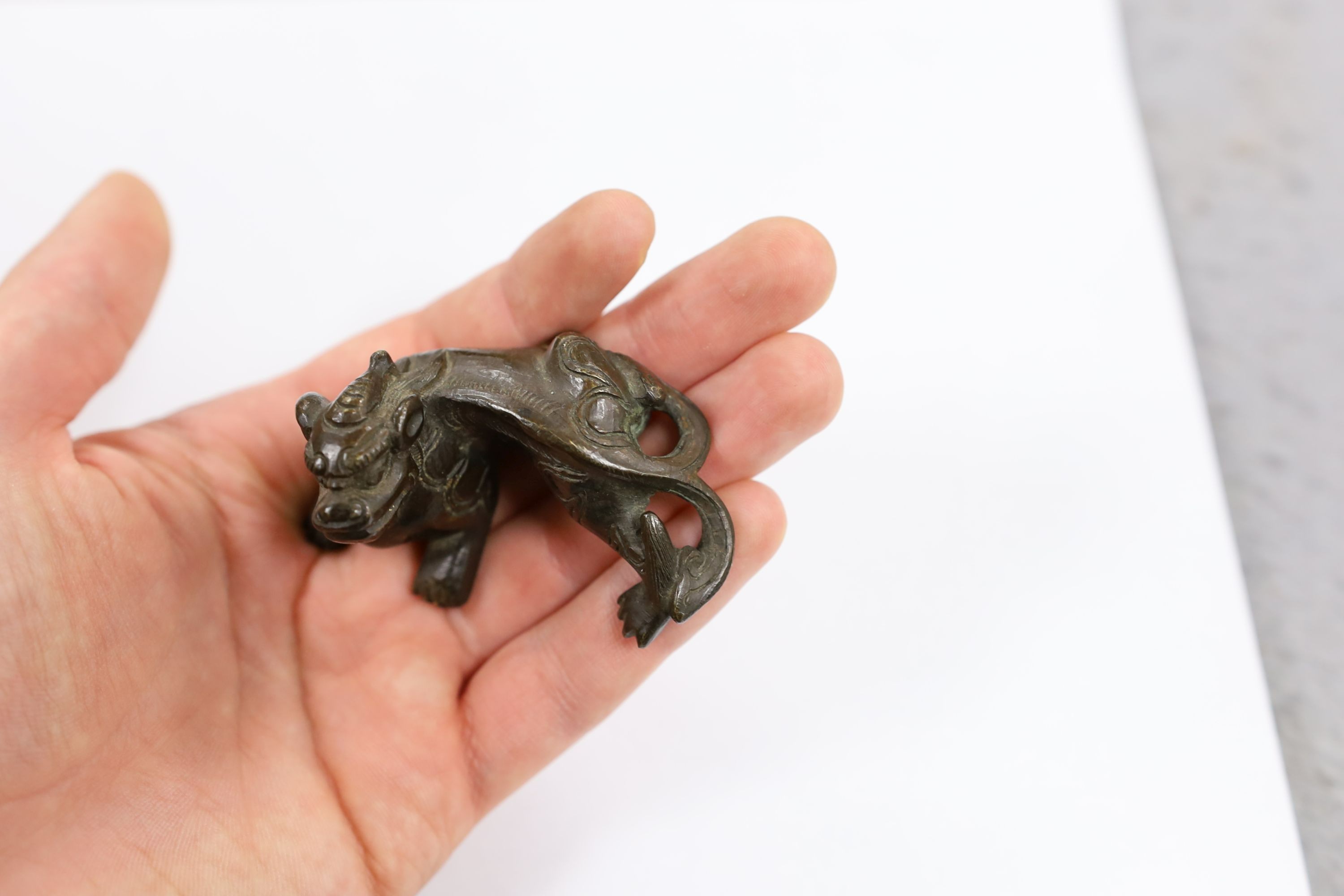 Five Chinese or Tibetan bronze figures or Buddhist implements, tallest 13cms high